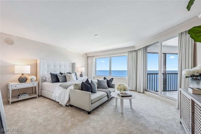 bedroom with access to outside, crown molding, a water view, and light colored carpet