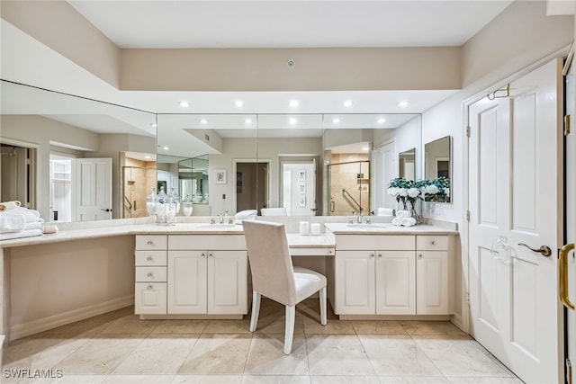 bathroom featuring vanity and a shower with shower door