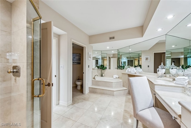 bathroom featuring vanity, tile patterned flooring, a bidet, and independent shower and bath