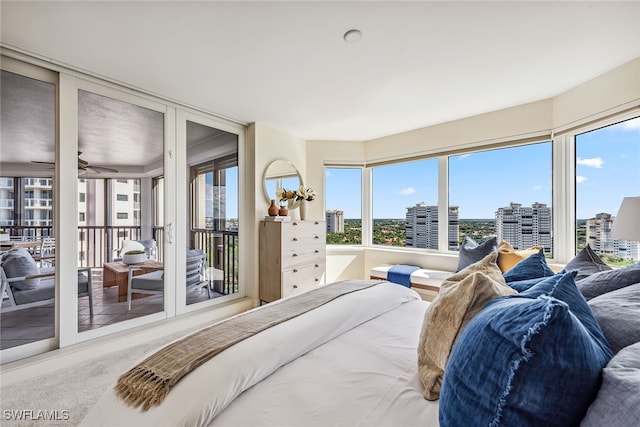 bedroom featuring carpet, access to outside, and multiple windows