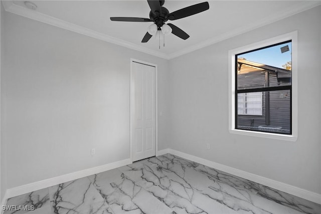 unfurnished room with ceiling fan and crown molding