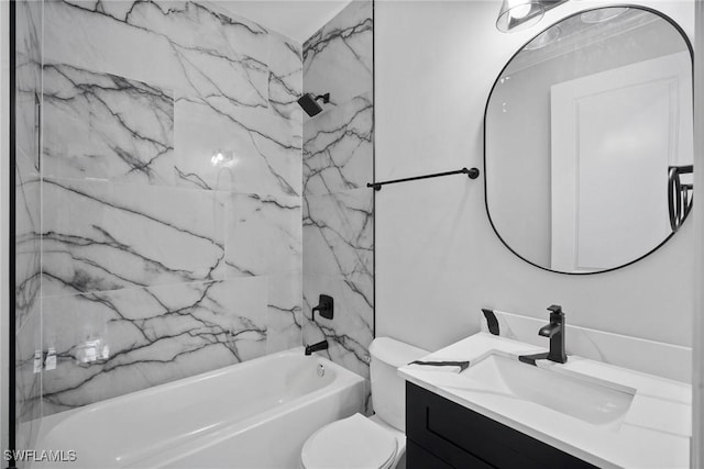 full bathroom with vanity, tiled shower / bath combo, and toilet