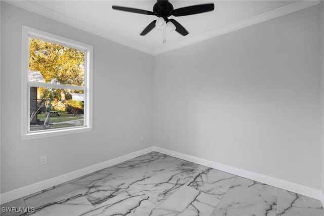 spare room featuring ceiling fan and ornamental molding