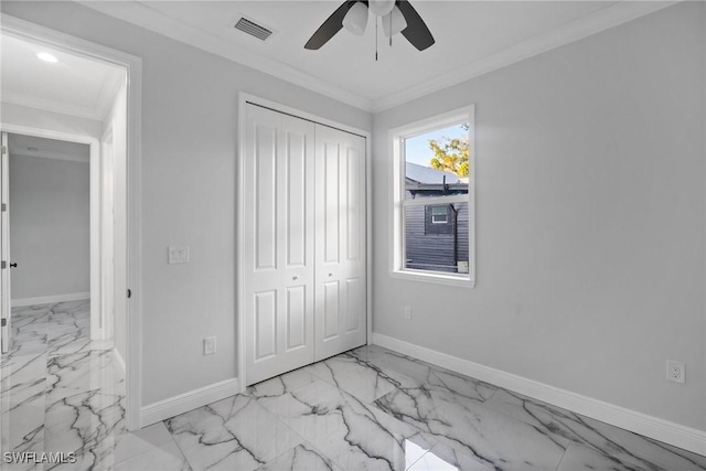 unfurnished bedroom featuring ceiling fan, ornamental molding, and a closet