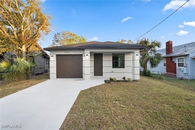 view of front facade with a garage and a front lawn