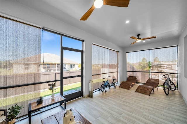 sunroom with a wealth of natural light and ceiling fan