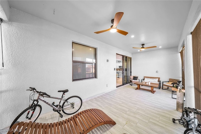 interior space featuring light wood-type flooring and ceiling fan