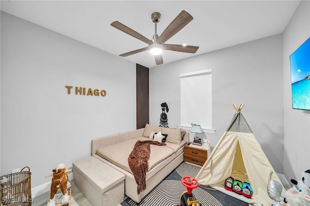 bedroom with hardwood / wood-style floors and ceiling fan