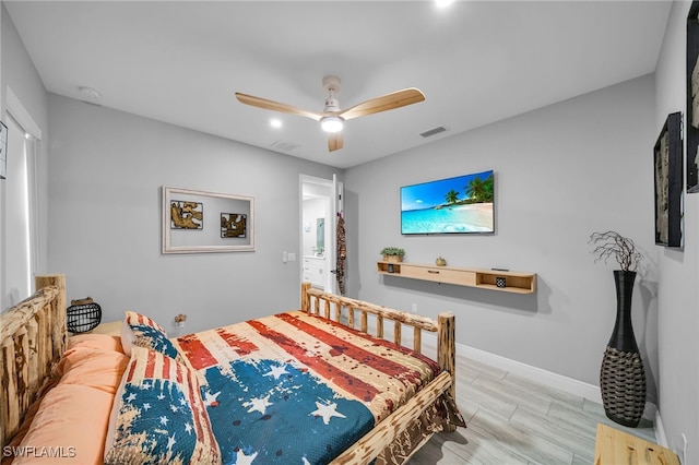 bedroom with light hardwood / wood-style floors and ceiling fan