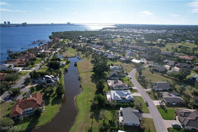 drone / aerial view with a water view