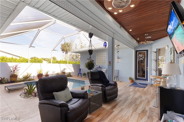 view of patio with a fenced in pool and ceiling fan