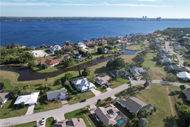 birds eye view of property featuring a water view