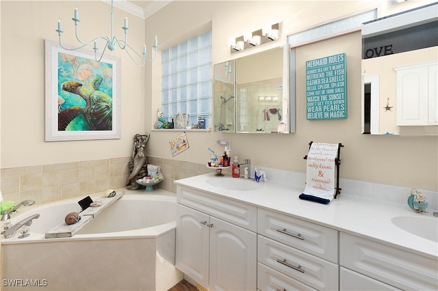 bathroom with vanity, a bathtub, and ornamental molding