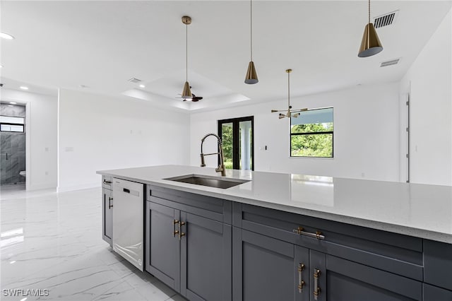 kitchen with light stone countertops, white dishwasher, gray cabinetry, and sink