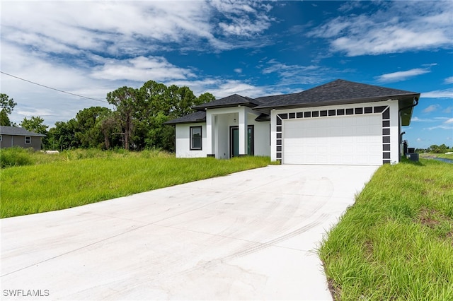 ranch-style home featuring a garage