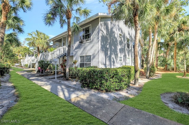 view of home's exterior with a yard