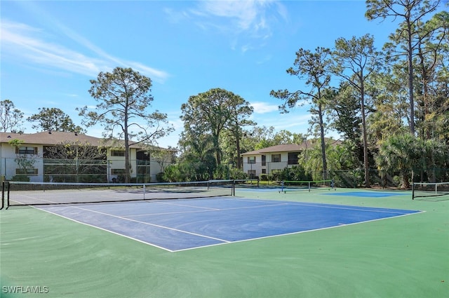 view of tennis court with basketball court