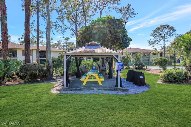 view of home's community with a gazebo and a lawn