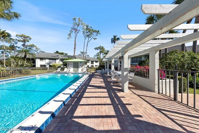 view of swimming pool featuring a pergola and a patio