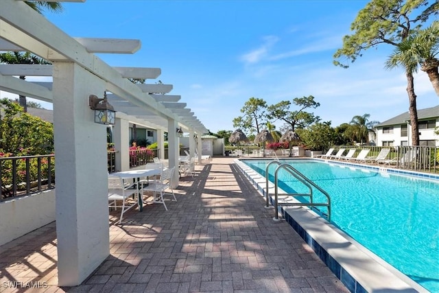 view of pool featuring a pergola and a patio