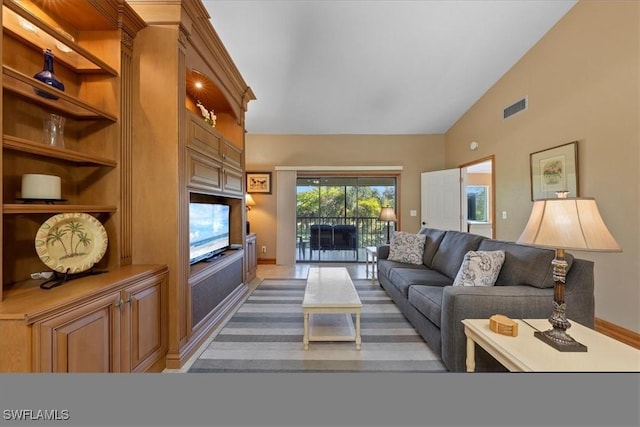 living room with lofted ceiling