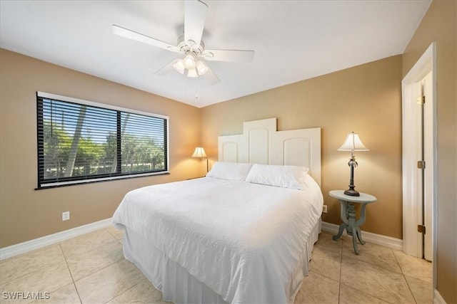 bedroom featuring light tile patterned floors and ceiling fan