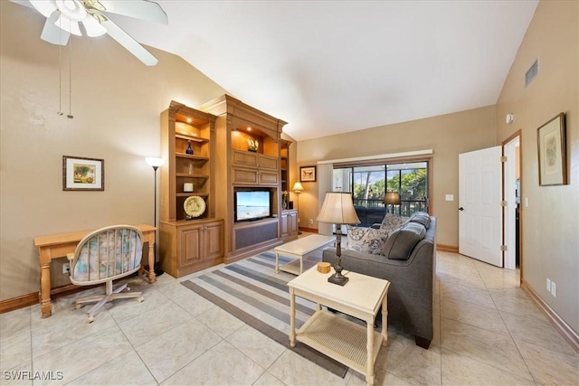 tiled living room featuring ceiling fan and vaulted ceiling