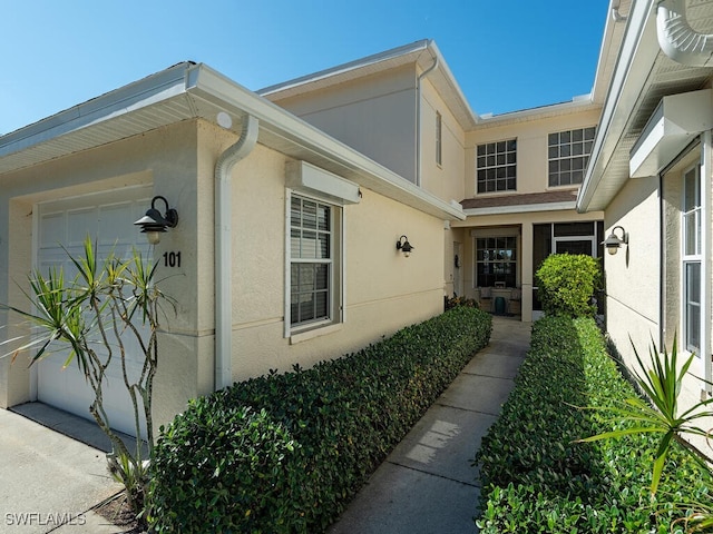 view of exterior entry featuring a garage