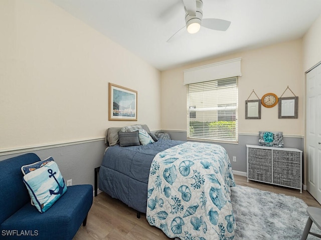 bedroom with ceiling fan and light wood-type flooring