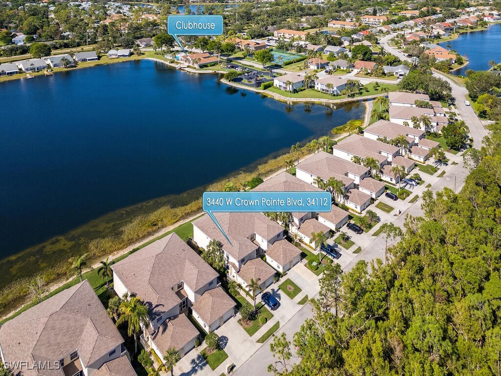 3440 W Crown Pointe Blvd Unit 9-101, Naples, FL 34112 - aerial view of property and surrounding area featuring nearby suburban area and a nearby body of water