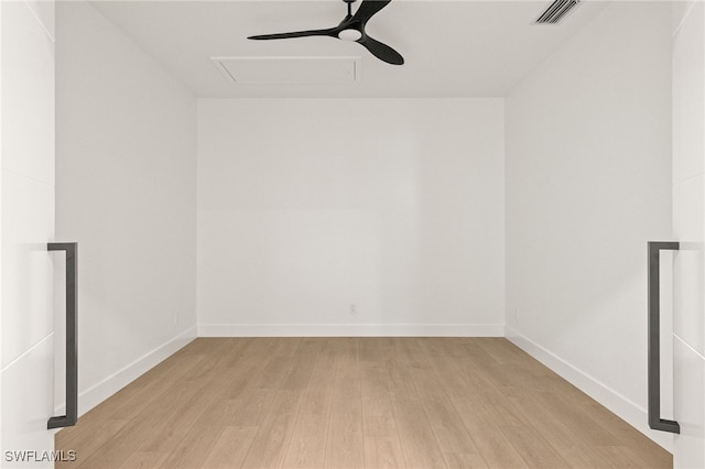 spare room featuring light wood-type flooring and ceiling fan