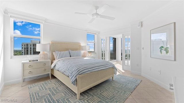 tiled bedroom featuring ceiling fan, ornamental molding, and multiple windows