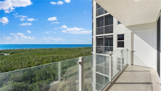 balcony featuring a water view