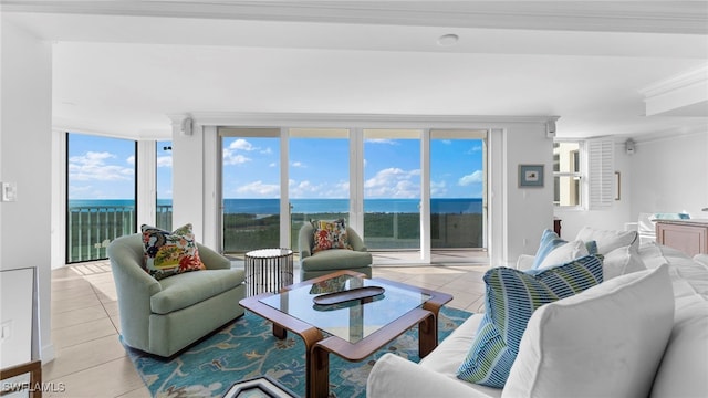 tiled living room with a water view and crown molding