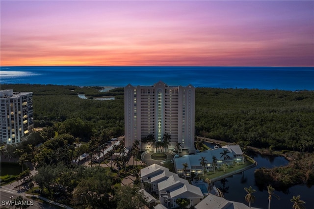 aerial view at dusk with a water view