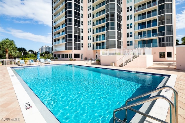 view of swimming pool featuring a patio