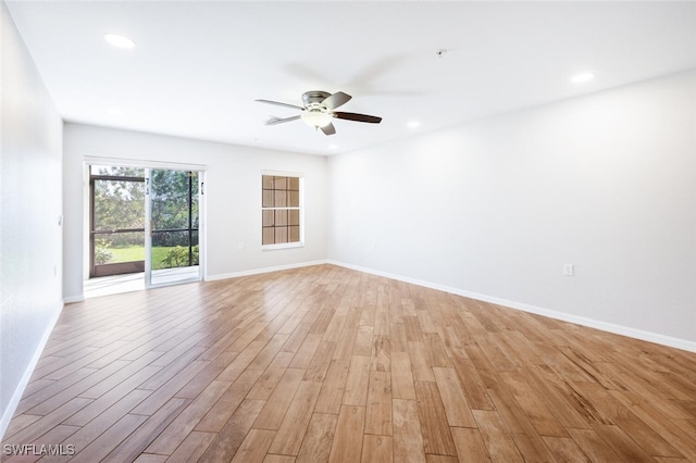 unfurnished room with ceiling fan and light hardwood / wood-style flooring