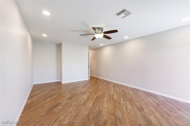 spare room with light hardwood / wood-style floors and ceiling fan