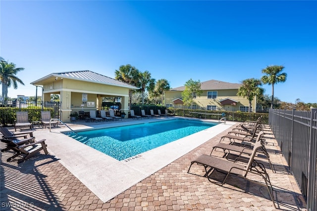 view of swimming pool featuring a gazebo and a patio area