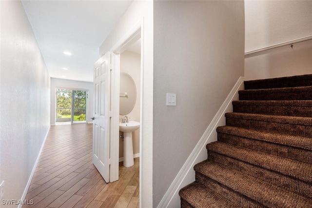 staircase featuring wood-type flooring