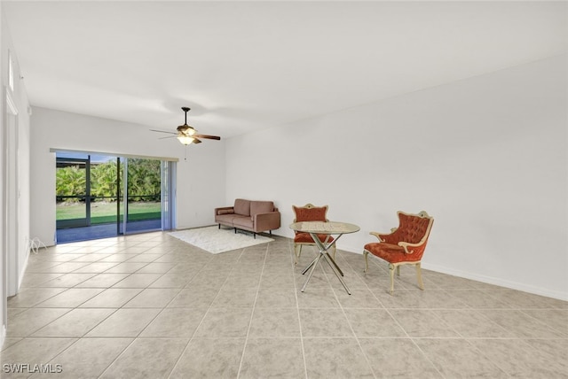 unfurnished room with ceiling fan and light tile patterned floors