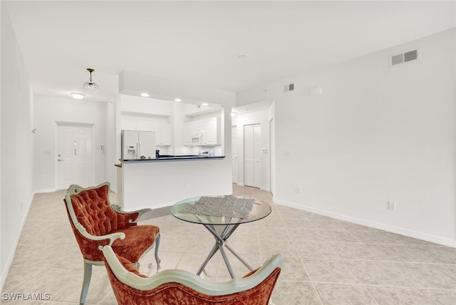 living area featuring light tile patterned floors