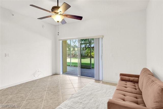 living room featuring ceiling fan and light tile patterned floors