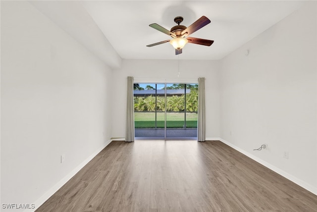 1101 Winding Pines Cir Unit 107, Cape Coral, FL 33909 - empty room featuring wood finished floors and a ceiling fan