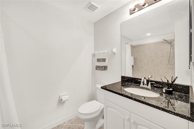 bathroom with tile patterned floors, a shower with curtain, toilet, and vanity