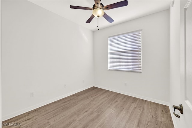 empty room featuring ceiling fan and light hardwood / wood-style floors