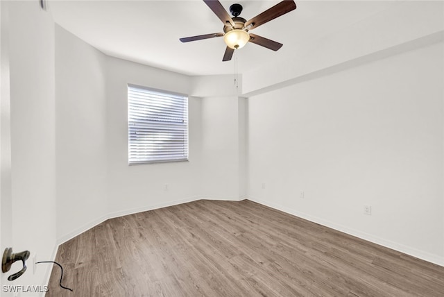 unfurnished room featuring light wood-type flooring and ceiling fan