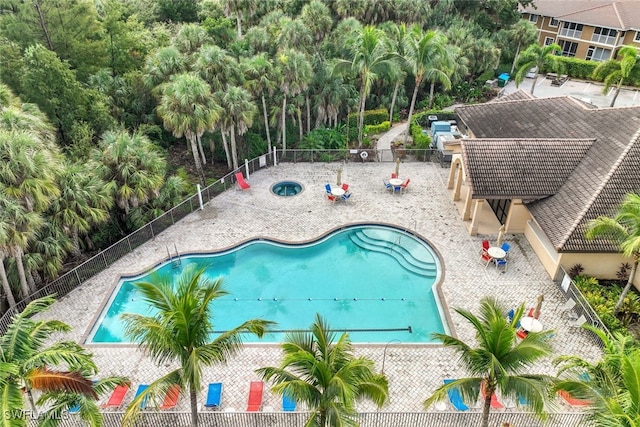 1101 Winding Pines Cir Unit 107, Cape Coral, FL 33909 - community pool featuring a fenced backyard and a patio