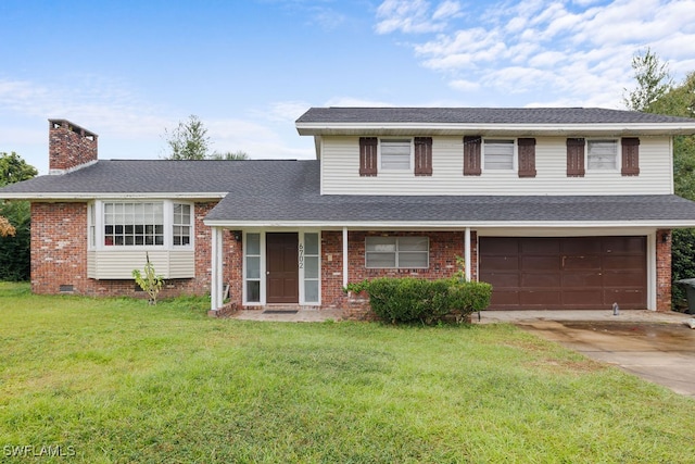 tri-level home featuring a front yard and a garage