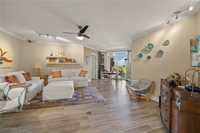 living room with ceiling fan, light hardwood / wood-style flooring, track lighting, and ornamental molding